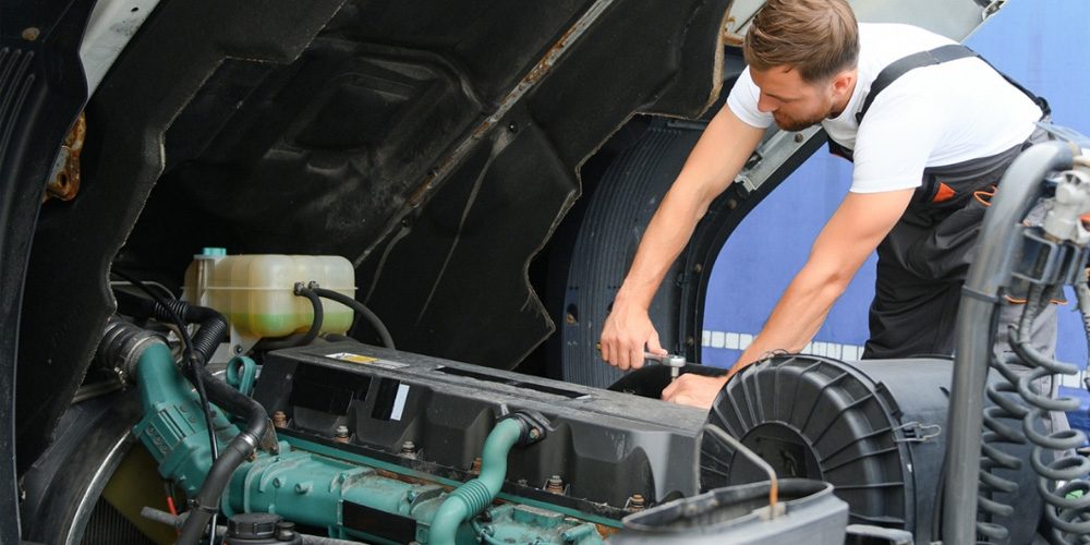 Image of Mechanic Fixing A Truck